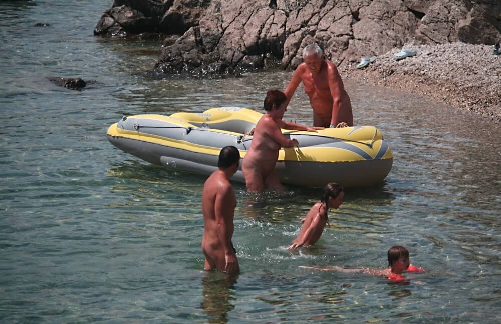 Lone Nudist in Yellow Boat photos