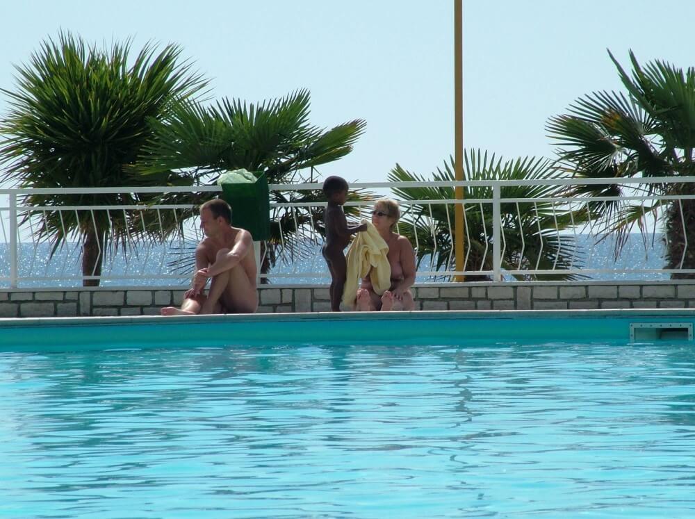 Photo of naturists in an outdoor pool